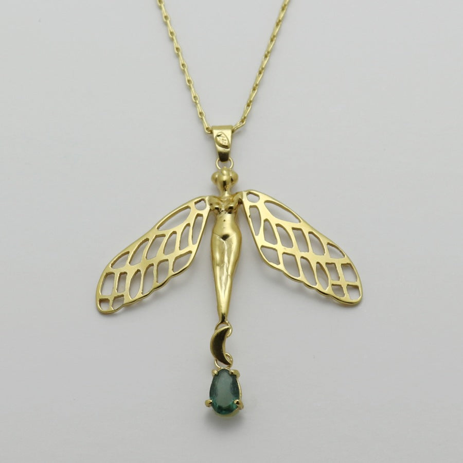 Image is a golden dragonfly woman and tourmaline pendant with a fancy chain necklace, handmade by Izaskun Zabala.