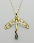 Image is a golden dragonfly woman and tourmaline pendant with a fancy chain necklace, handmade by Izaskun Zabala.