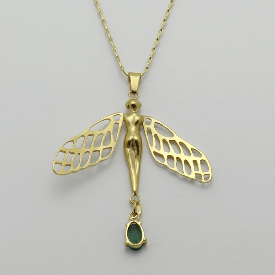 Image is the back of a golden dragonfly woman and tourmaline pendant with a fancy chain necklace, handmade by Izaskun Zabala.