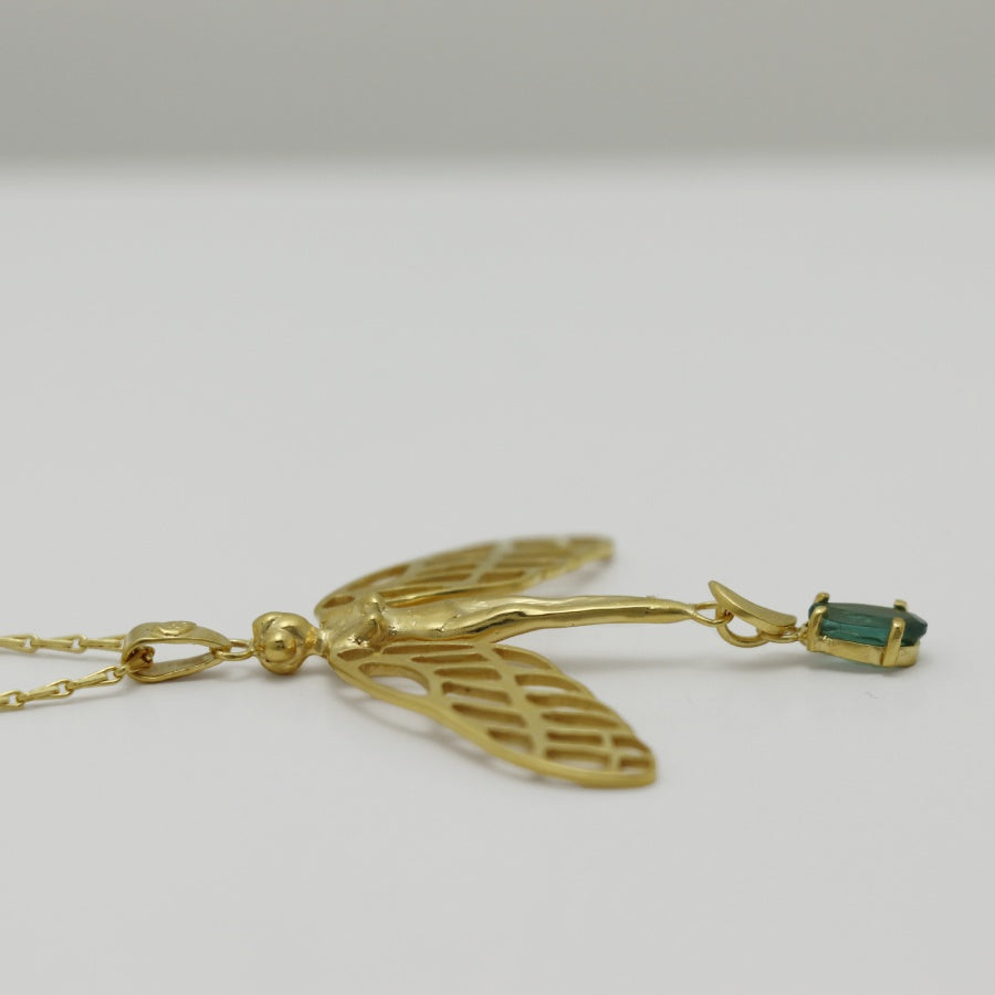 Image is a golden dragonfly woman and tourmaline pendant with a fancy chain necklace, handmade by Izaskun Zabala.