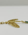 Image is a golden dragonfly woman and tourmaline pendant with a fancy chain necklace, handmade by Izaskun Zabala.