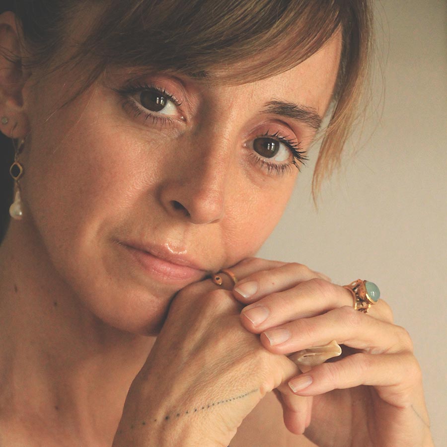 Image is a 24K gold plated statement ring with a 10mm chalcedony cabochon, handmade by Izaskun Zabala.