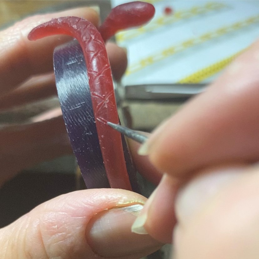 Image is a wax carved snake cuff, handmade by Izaskun Zabala.