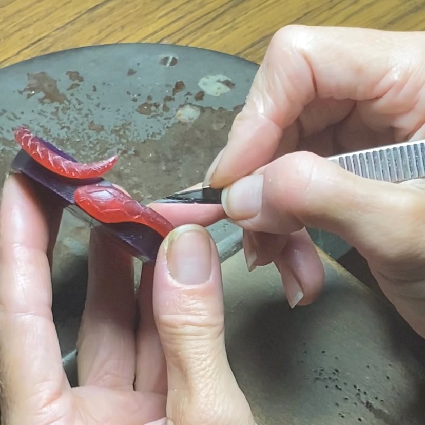 Image is a wax carved snake cuff, handmade by Izaskun Zabala.
