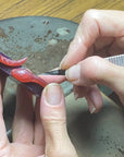 Image is a wax carved snake cuff, handmade by Izaskun Zabala.
