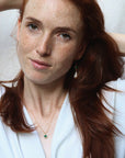 Image is a gold filled chain necklace with a cushion cut stone, handmade by Izaskun Zabala.