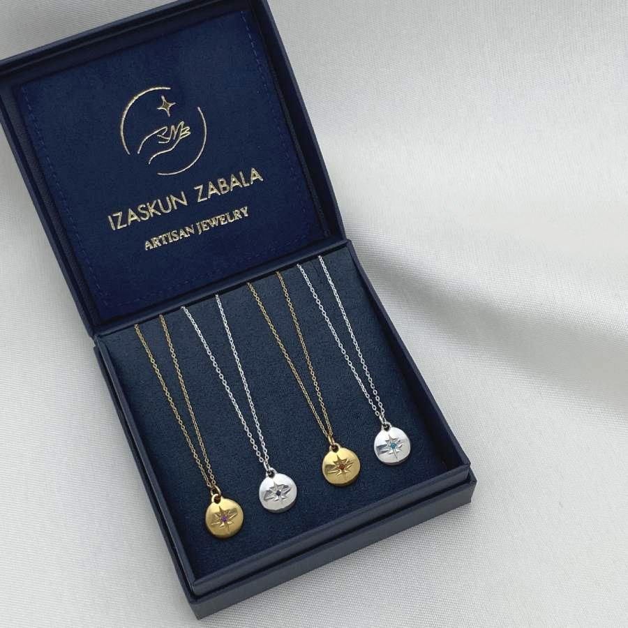 Image is gold-plated and silver birthstone medallion pendant delicate necklaces, displayed in the brand's packaging.
