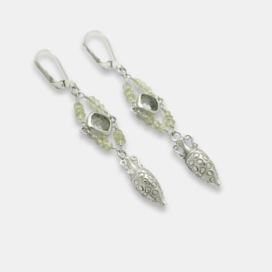 Side view of silver drop amphora earrings with green amethyst and moonstone beads on a white background, handmade by Izaskun Zabala.