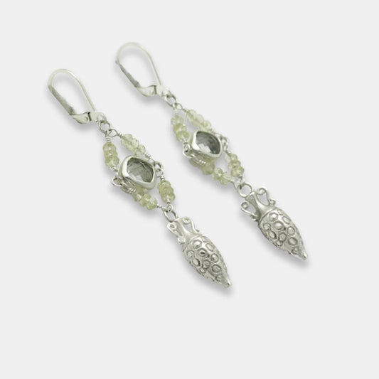 Side view of silver drop amphora earrings with green amethyst and moonstone beads on a white background, handmade by Izaskun Zabala.