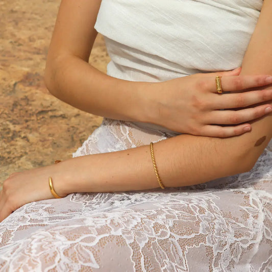 Rope like Ariadne Cuff in gold-plated brass styled on a model