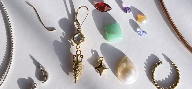 Different metals like silver, copper, brass and gold, with various natural gemstones.