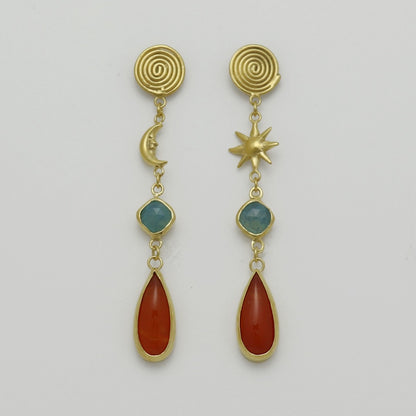 Image is a pair of 24K gold plated drop earrings with spiral stud, celestial motifs, chalcedony and carnelian gemstones, handmade by Izaskun Zabala.