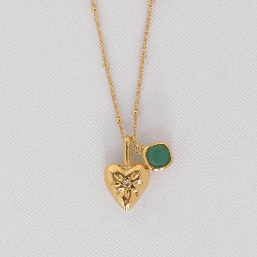 Image is a 24K gold plated heart pendant with a chrysoprase charm necklace, handmade by Izaskun Zabala.