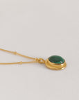 Image is a delicate 24K gold plated pendant with oval cabochon and gold filled chain, handmade by Izaskun Zabala.