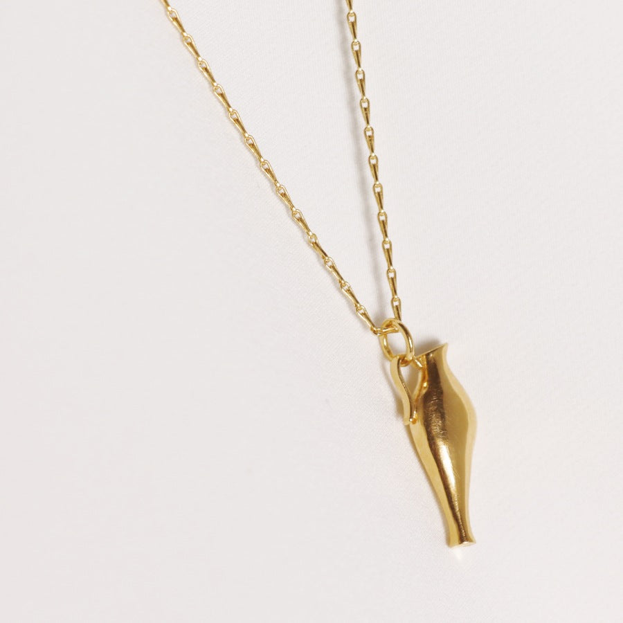 Image is a 24K gold plated necklace with an amphora pendant and fancy chain, handmade by Izaskun Zabala.