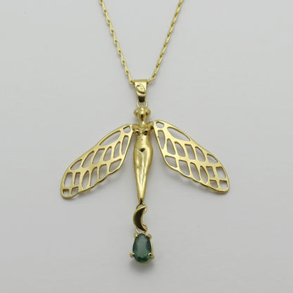 Image is a golden dragonfly woman and tourmaline pendant with a fancy chain necklace, handmade by Izaskun Zabala.