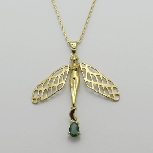 Image is a golden dragonfly woman and tourmaline pendant with a fancy chain necklace, handmade by Izaskun Zabala.