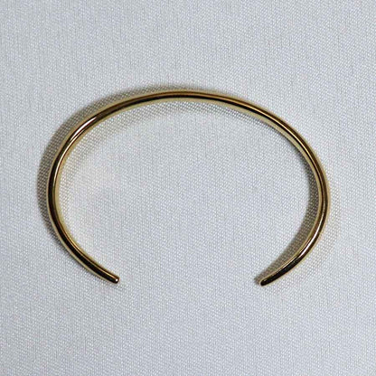 Image is an elegant 24K gold plated brass cuff, handmade by Izaskun Zabala.