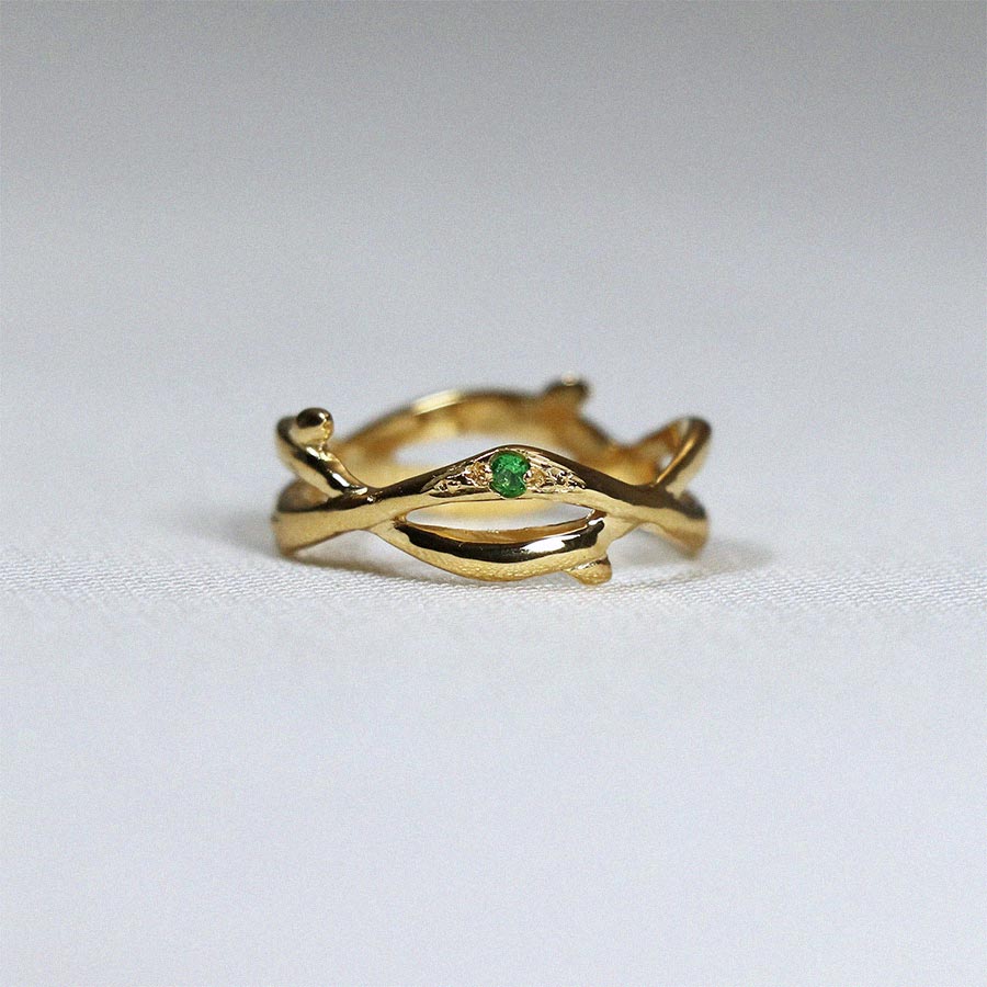 Image is a 24K gold plated branch ring with tsavorite stones, handmade by Izaskun Zabala.