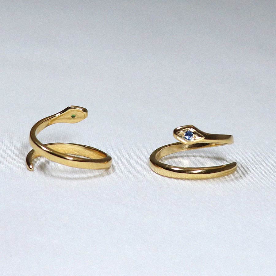 Image is a 24K gold plated minimalist snake ring, handmade by Izaskun Zabala.