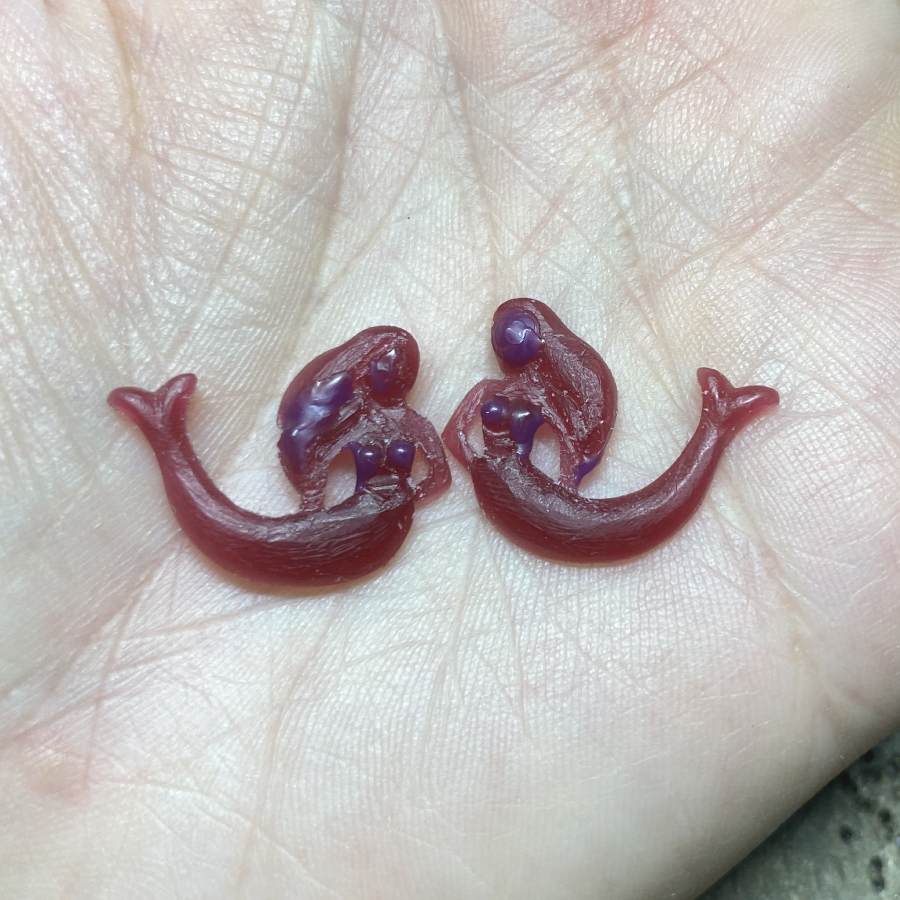 Image is a pair of wax carved mermaid earrings, handmade by Izaskun Zabala.