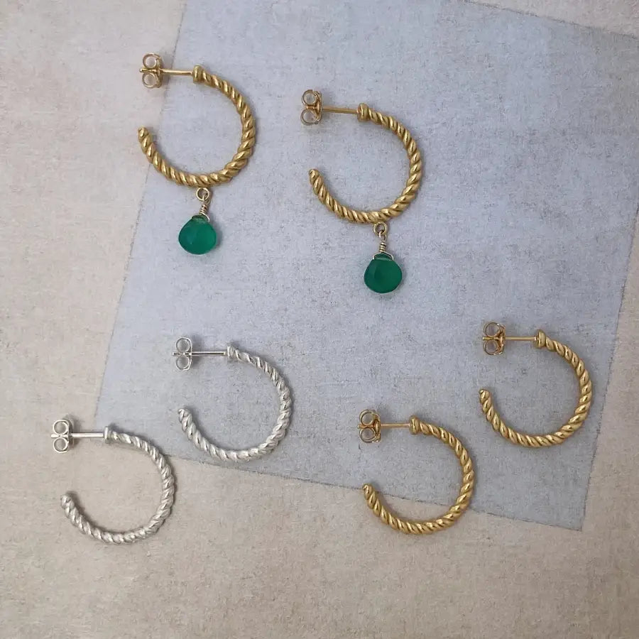 Medium twisted hoop earrings handcrafted in silver and gold-plated brass