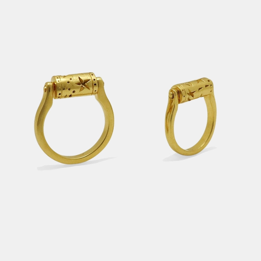 Pair of gold-plated rings with a rotating top cilinder, handmade by Izaskun Zabala.