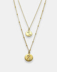 Two gold-plated yin yang pendants with sapphires necklaces, handmade by Izaskun Zabala.