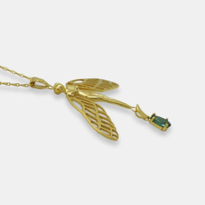 Detail of gold-plated dragonfly woman and tourmaline pendant with a fancy chain necklace, handmade by Izaskun Zabala.