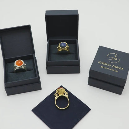 Silver and gold-plated statement ring in Izaskun Zabala branded boxes.