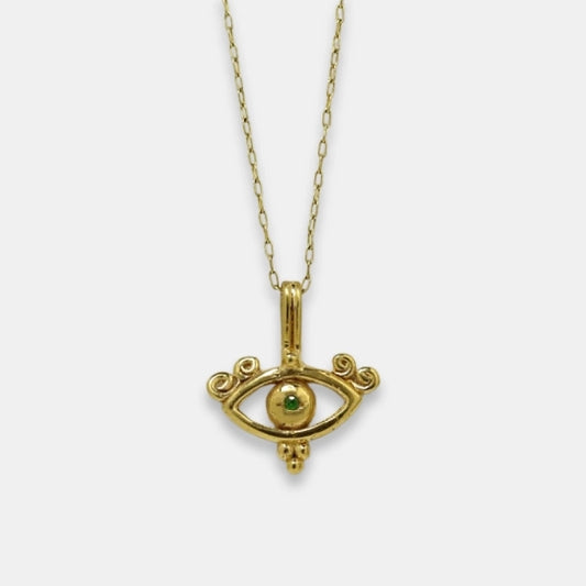 Gold-plated symbolic necklace with all-seeing eye inspired pendant and green tsavorite, handmade by Izaskun Zabala.