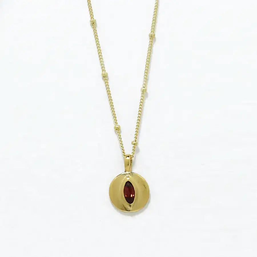 24K gold-plated small disk pendant with garnet marquise delicate necklace, handmade by Izaskun Zabala.