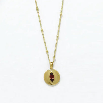 24K gold-plated small disk pendant with garnet marquise delicate necklace, handmade by Izaskun Zabala.