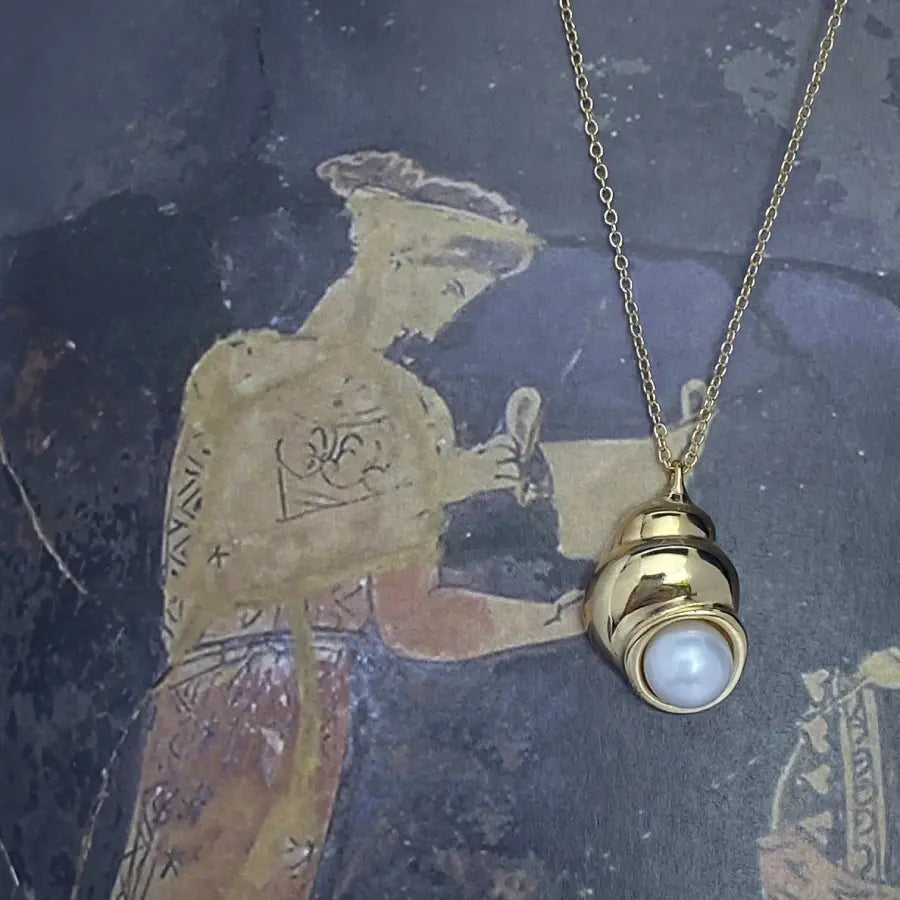 Shell-inspired Nerea Necklace featuring a button pearl