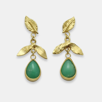 Gold-plated leaf earrings with green teardrop stone, handmade by Izaskun Zabala.