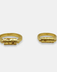 Flat view of gold-plated rings with a rotating top cilinder, handmade by Izaskun Zabala.