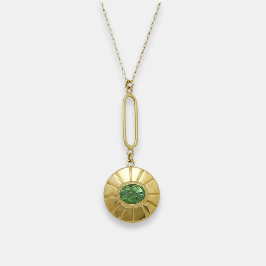 Gold-plated pendulum necklace with a green turmaline pendant, handmade by Izaskun Zabala.