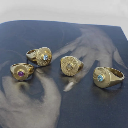 Handcrafted gemstone signet rings with sculptural design