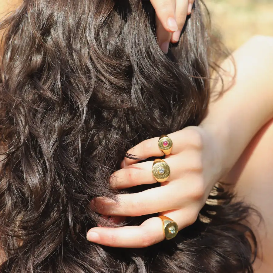 Signet Rings with center cabochon gemstone worn on a model