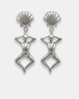 Pair of silver earrings with shell-like tops and female figure dangles, handmade by Izaskun Zabala.