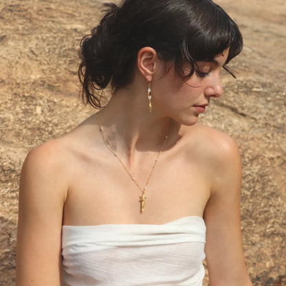 Gold-plated Sirena Necklace with pearl accents styled on a model