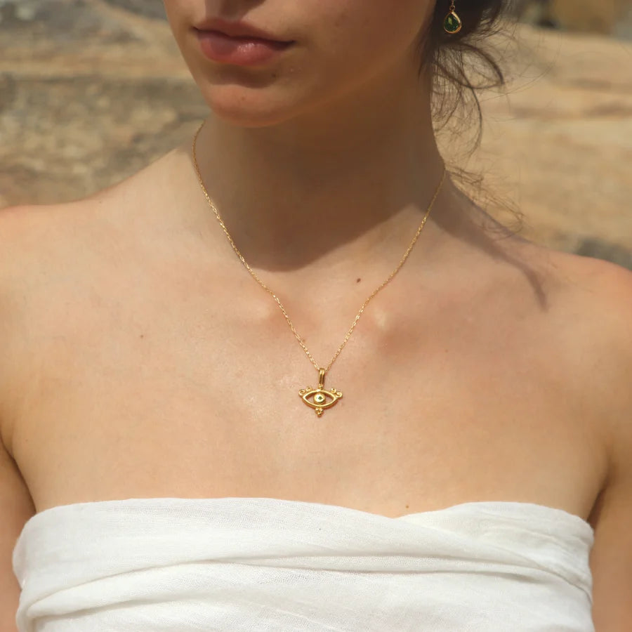 Solar Gaze Necklace with tsavorite in gold-plated brass worn on a model