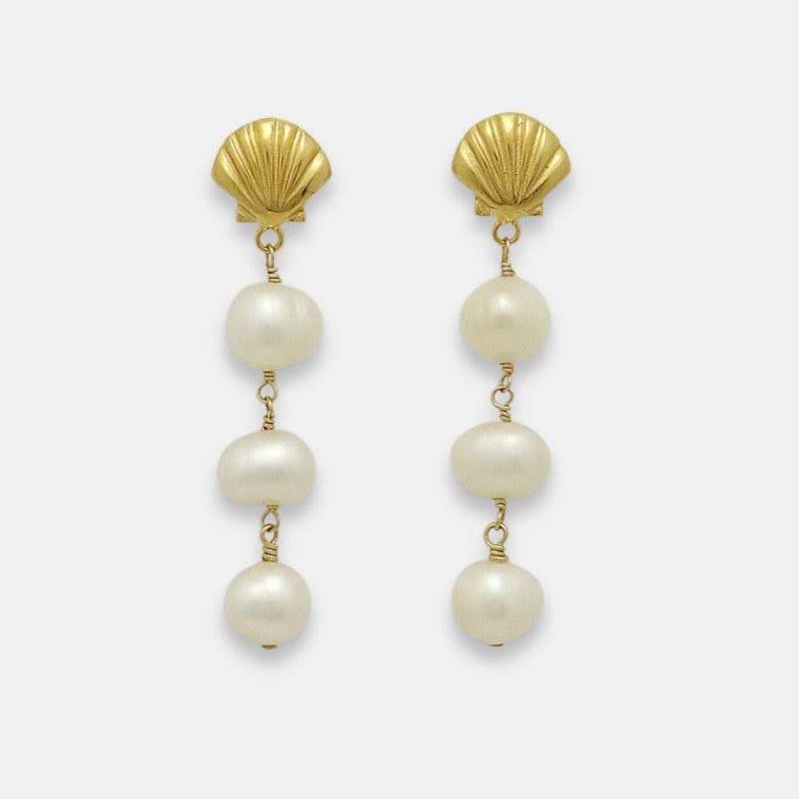 Pair of gold-plated earrings with shell studs and pearl drops, handmade by Izaskun Zabala.