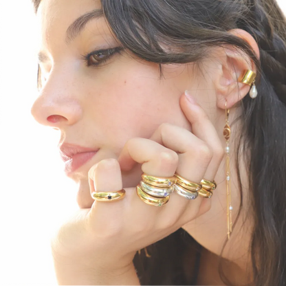 Gold-plated and silver Venus Star Rings with center gemstone styled on a model