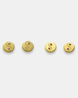 Gold-plated yin yang stud earrings with sapphires, handmade by Izaskun Zabala.