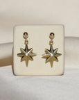 Izaskun Zabala Jewelry delicate star dangle earrings with a white sapphire on a ball stud