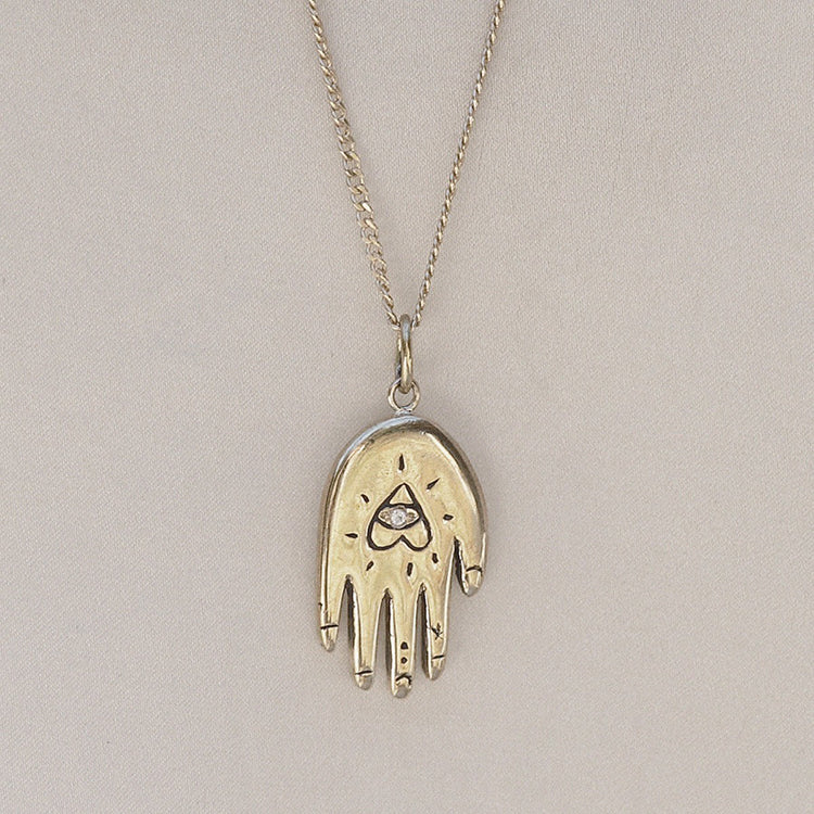 Izaskun Zabala jewelry reversible hand palmistry necklace with astrological symbols