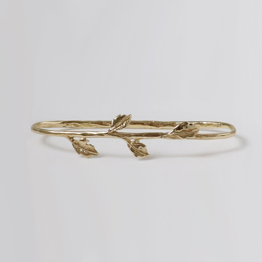 Image is a palm cuff with small leaves motif, handmade by Izaskun Zabala.