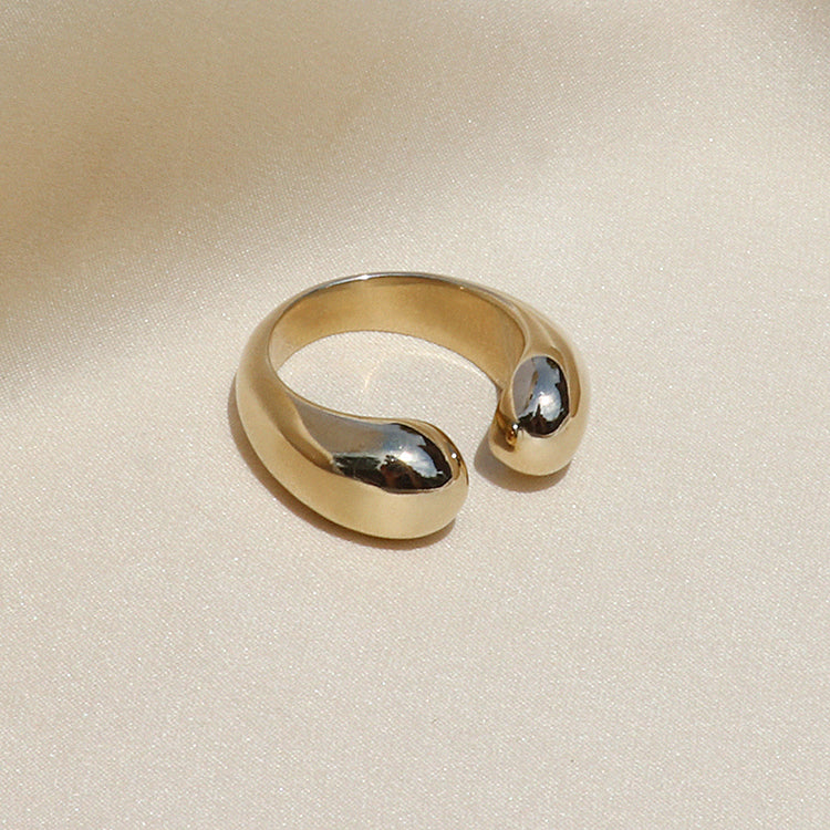 Image is an adjustable brass ring with two opened dome shapes, handmade by Izaskun Zabala.